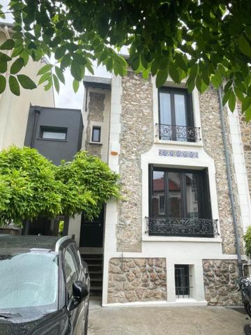 Maison d'architecte avec jardin arboré à 2 pas du centre du Perreux