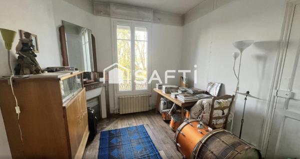 Duplex à fort potentiel avec jardin