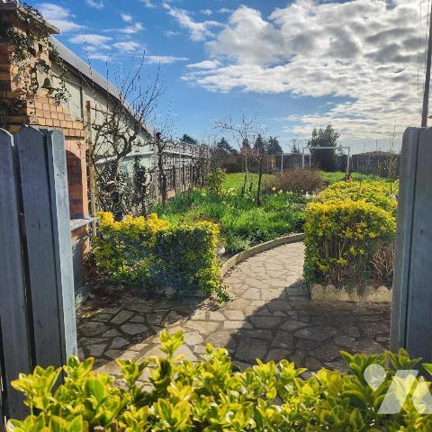 Maison familiale avec garage, jardin clos et véranda