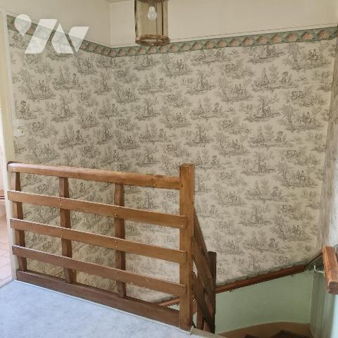 Maison familiale avec garage, jardin clos et véranda