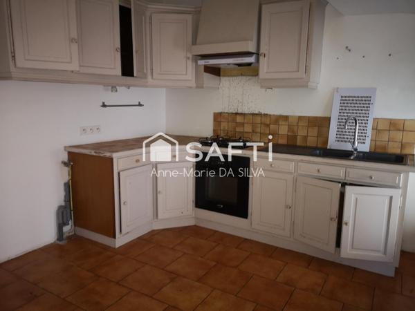 Maison divisée en 2 appartements