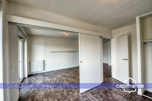 PÉRIGNY (17) – Élégant T3 modulable avec grande terrasse couverte & parking sous-sol