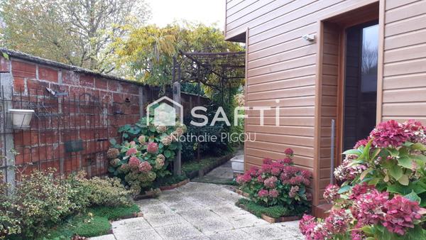 Grande maison familiale avec patio, garage double et atelier