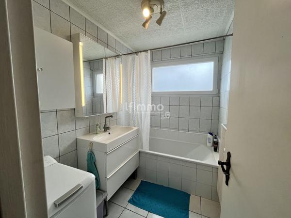 Appartement traversant 4 pièces 95m², balcon, garage et cave