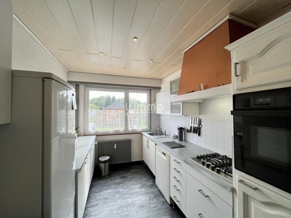 Appartement traversant 4 pièces 95m², balcon, garage et cave