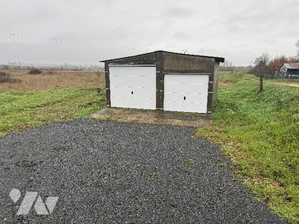 Garage avec terrain attenant