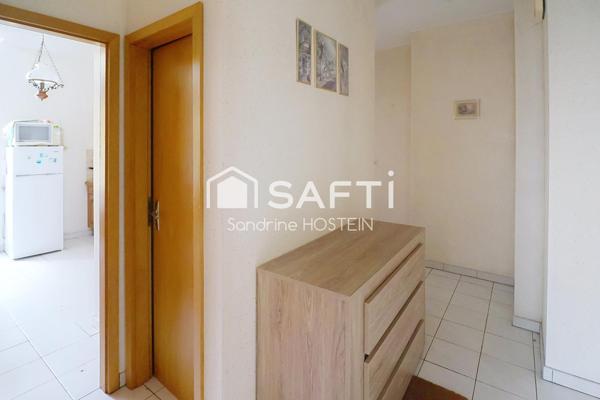 Appartement de 60m2 avec 1 chambre, garage et cave privée.