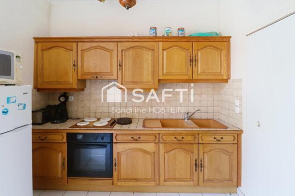 Appartement de 60m2 avec 1 chambre, garage et cave privée.
