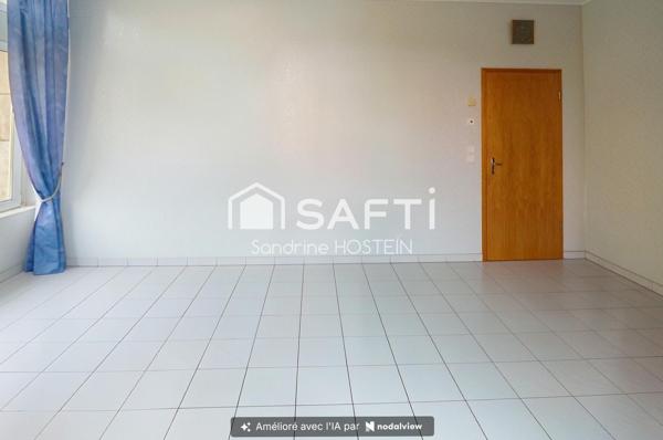 Appartement de 60m2 avec 1 chambre, garage et cave privée.