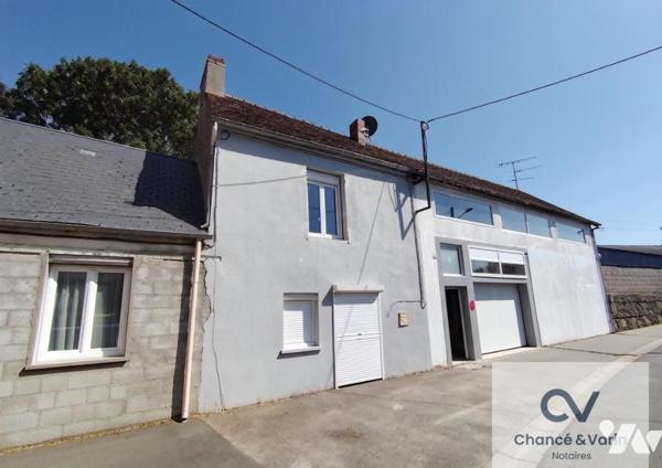 immeuble comprenant une maison d'habitation louée et box de stockage