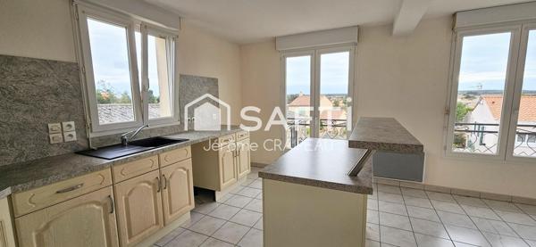 2 logements de 3 chambres, 2 garages et atelier en centre-ville.