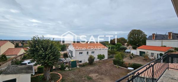 2 logements de 3 chambres, 2 garages et atelier en centre-ville.