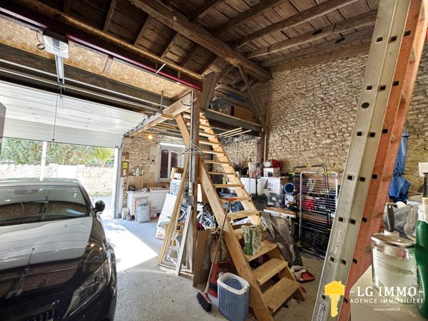 Maison de plain-pied avec jardin et garage en centre ville