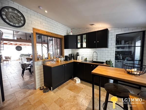 Maison de plain-pied avec jardin et garage en centre ville