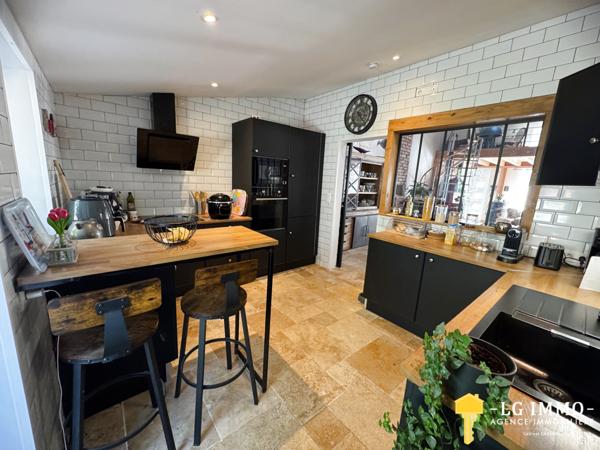 Maison de plain-pied avec jardin et garage en centre ville