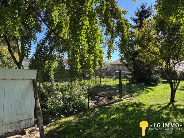 Maison de plain-pied avec jardin et garage en centre ville