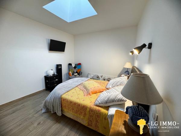 Maison de plain-pied avec jardin et garage en centre ville