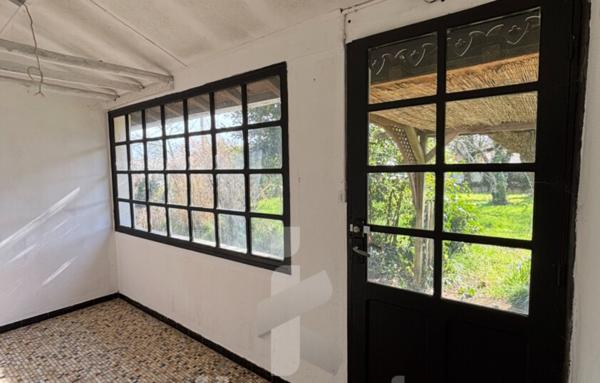 Maison à rénover 61 m2 avec terrain de 1200 m2, garage et possibilités de division