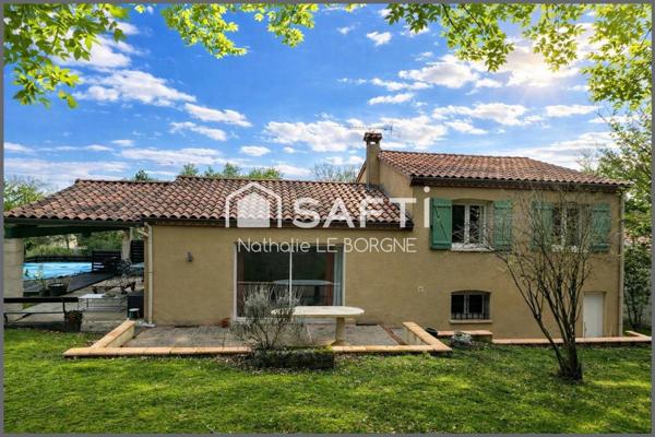Maison sur demi sous sol avec terrain boisé
