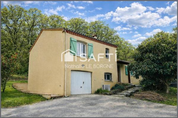 Maison sur demi sous sol avec terrain boisé