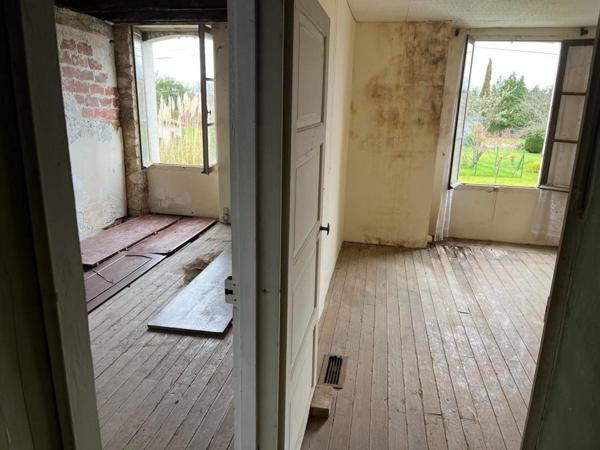 Maison avec terrain non attenant et grange