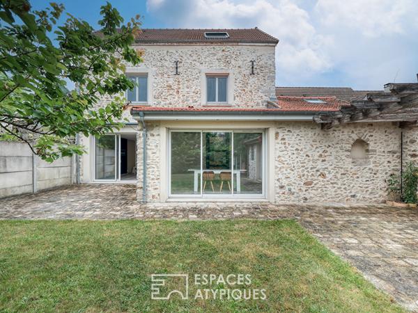 La maison meulière à la rénovation contemporaine avec atelier et jardin
