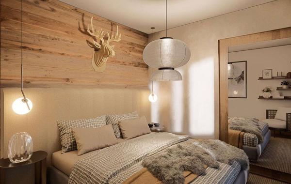 Duplex en dernier étage avec balcons dans un chalet haut-de-gamme