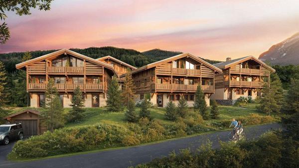Duplex en dernier étage avec balcons dans un chalet haut-de-gamme