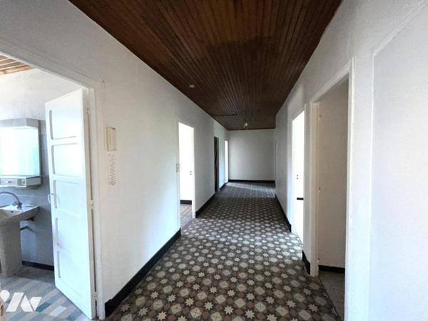 Ensemble de deux logements avec garage, cave et jardin de 633 m²