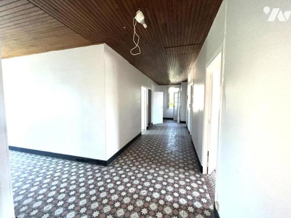 Ensemble de deux logements avec garage, cave et jardin de 633 m²