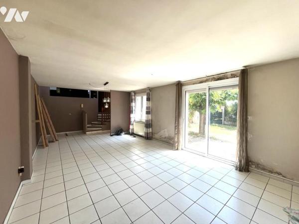 Ensemble de deux logements avec garage, cave et jardin de 633 m²