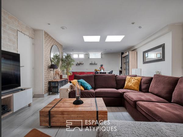 Maison esprit loft en souplex avec jardin d’hiver et extérieur.