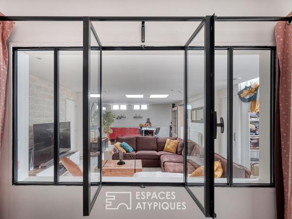 Maison esprit loft en souplex avec jardin d’hiver et extérieur.