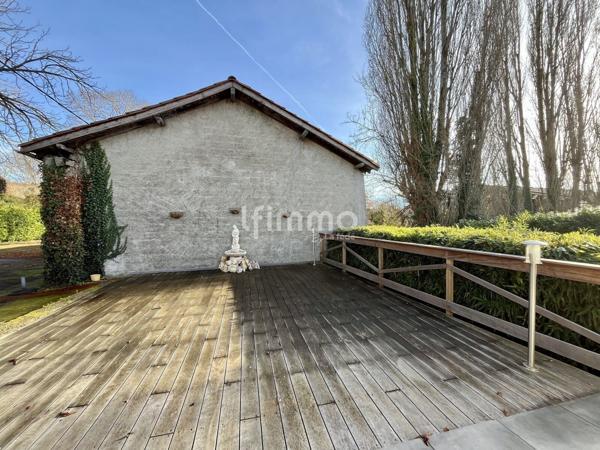 Maison avec sous-sol complet et ancienne minoterie