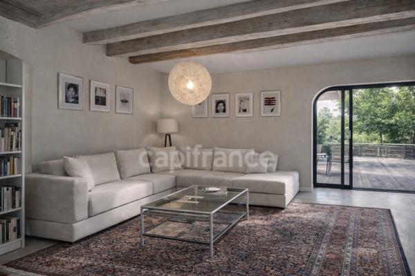 PRÉVESSIN-MOËNS – Ancienne forge du XIXᵉ transformée en loft – 187 m² – 3 chambres – Jardin