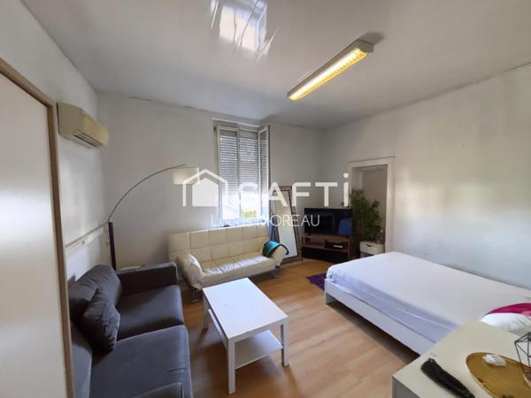 Immeuble de rapport de 2 locaux et un plateau R+1