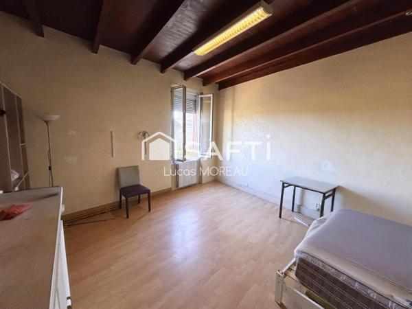 Immeuble de rapport de 2 locaux et un plateau R+1