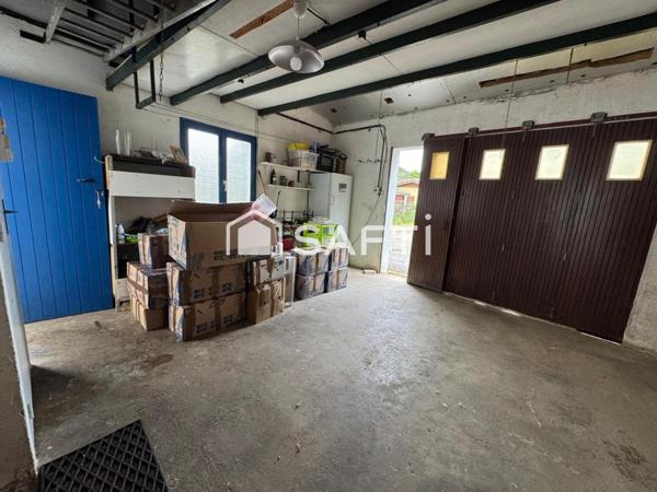 MAISON AVEC JARDIN ET UN GARAGE