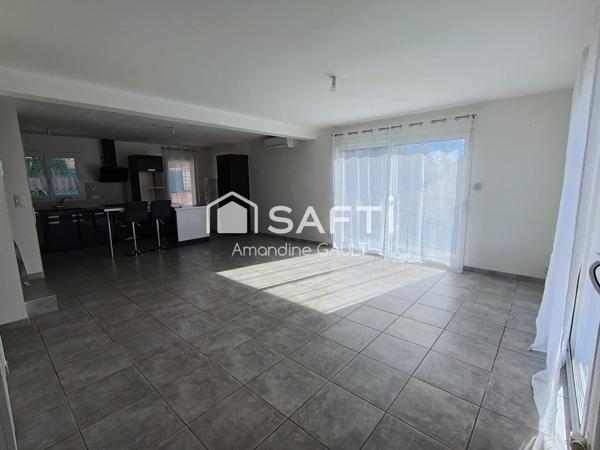 Maison avec jardin associant performance et charme prêts à vivre !