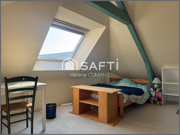 Élégante maison de maître rénovée – proche des commerces, jardin et garage.