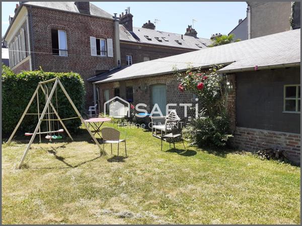 Élégante maison de maître rénovée – proche des commerces, jardin et garage.