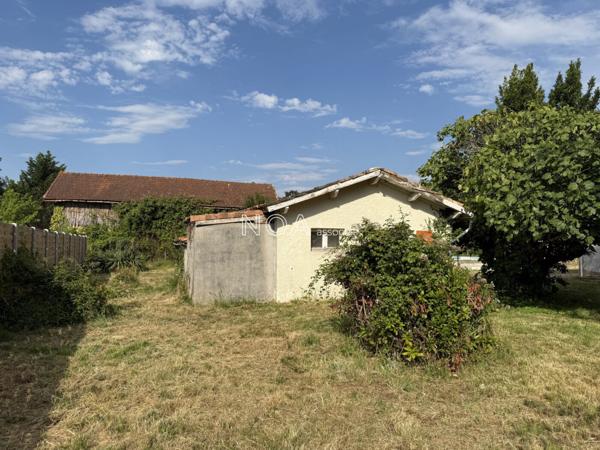 Terrain avec bâti existant, centre bourg