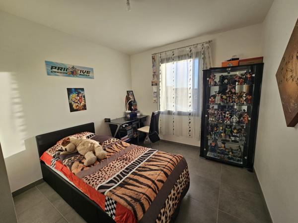 Montamisé, maison Plain pied de type 5 avec garage et jardin.