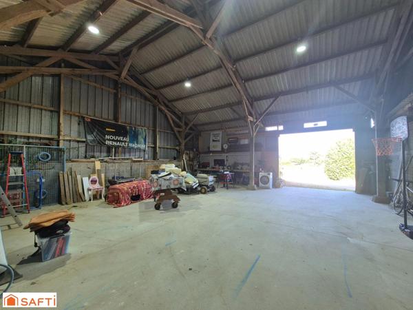 Maison avec hangar et terrain constructible