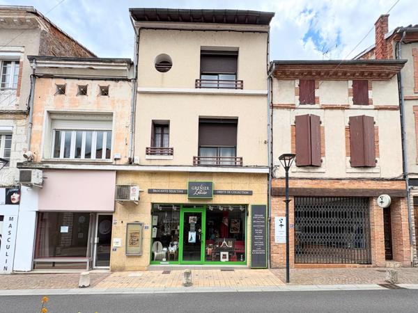 Immeuble mixte avec terrasse, garage et potentiel