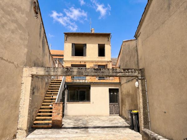 Immeuble mixte avec terrasse, garage et potentiel