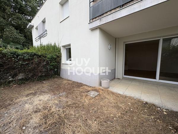 Charmant rez-de-jardin avec stationnement sécurisé
