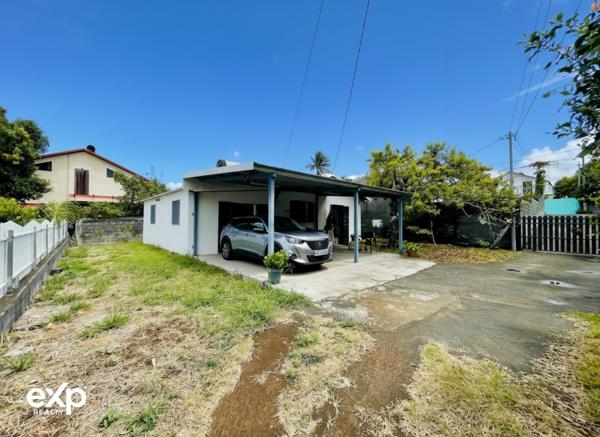 Maison de plain-pied 4 pièces avec terrasse couverte et jardin arboré