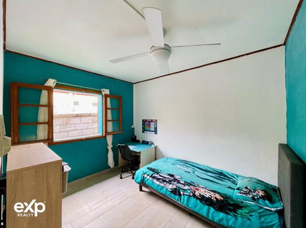 Maison de plain-pied 4 pièces avec terrasse couverte et jardin arboré