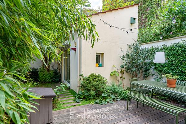 Maison familiale avec jardin intimiste et studio indépendant.